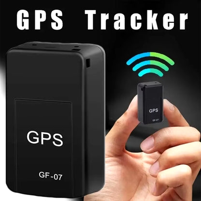 GF07 mini GPS tracker held between fingers showing small size